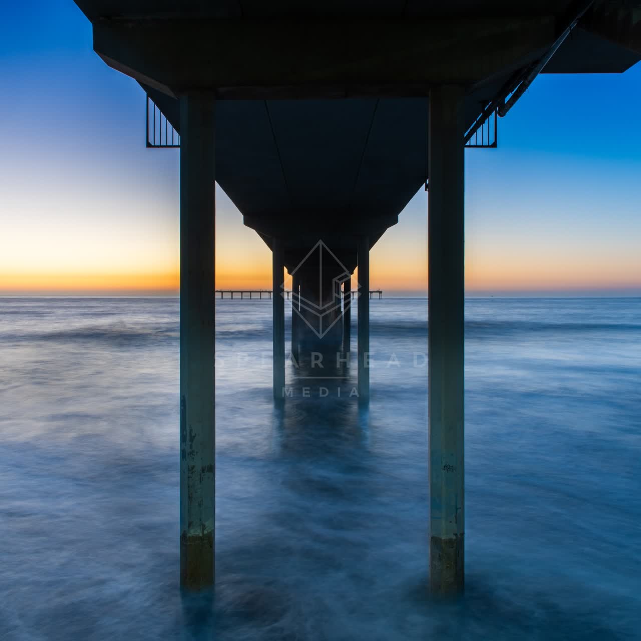 View from the water of the beach, the surf and the pier in Ocean Beach.
