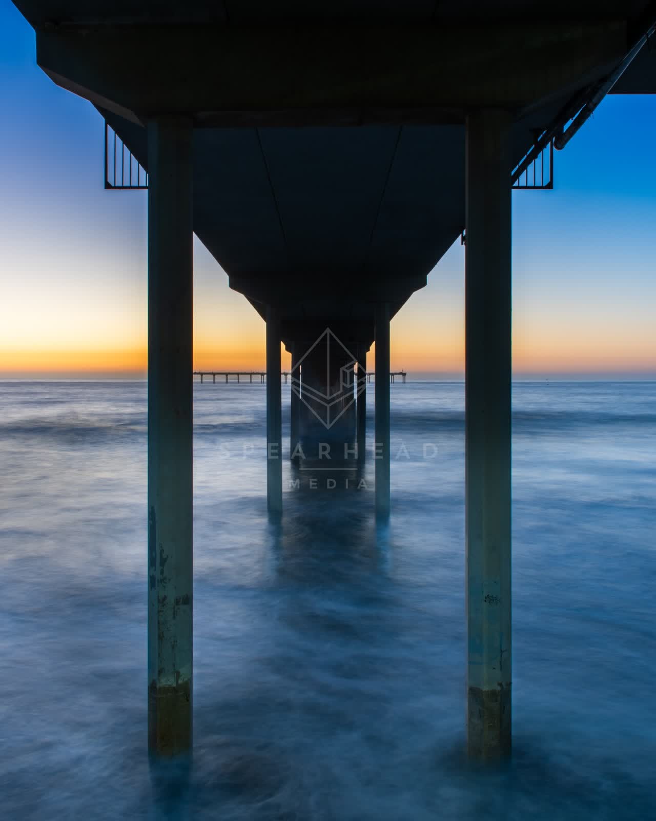 View from the water of the beach, the surf and the pier in Ocean Beach.