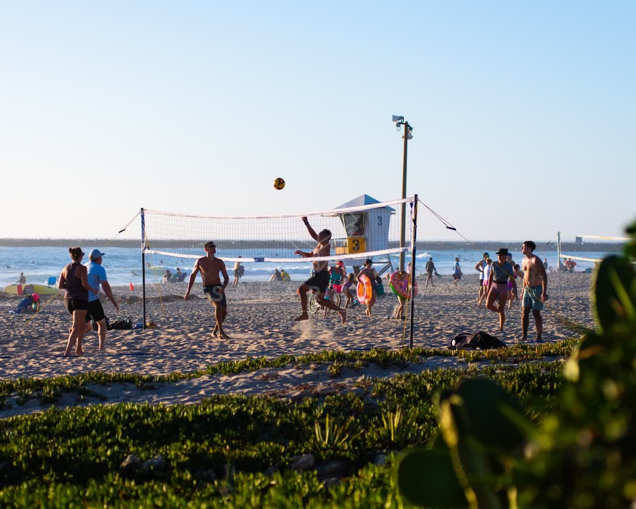 The beach, the surf and the ocean in Ocean Beach, with swimmers in the water.