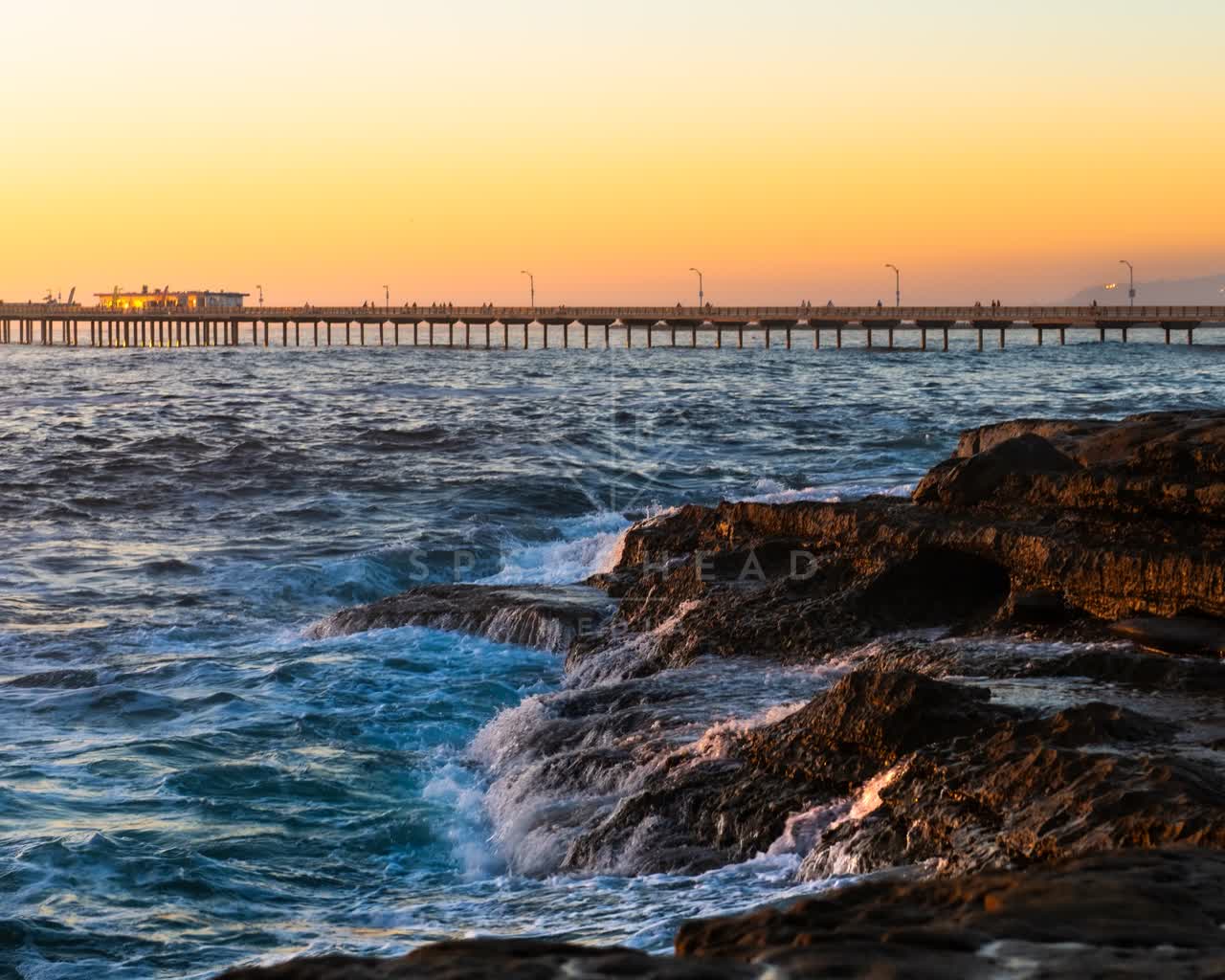 The cliffs, the surf and the pier in Ocean Beach.