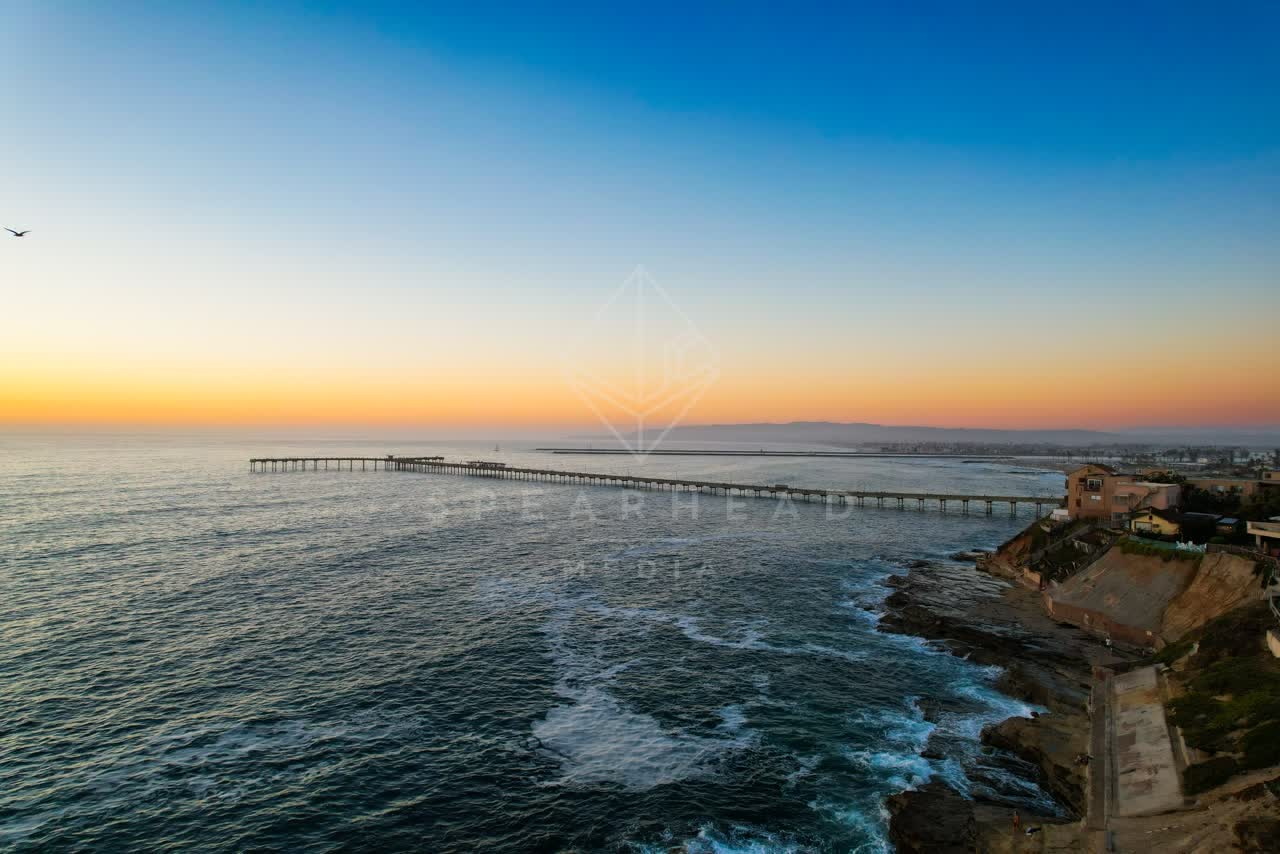 Aerial view of the cliffs, the pier and the ocean in Ocean Beach.