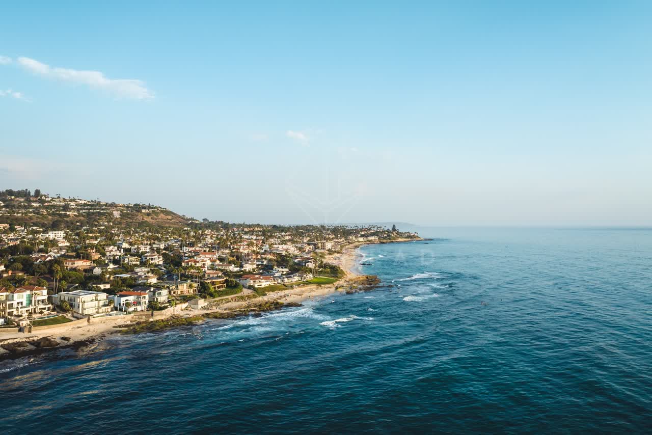 Aerial view of the cliffs, the ocean and homes at Windansea.