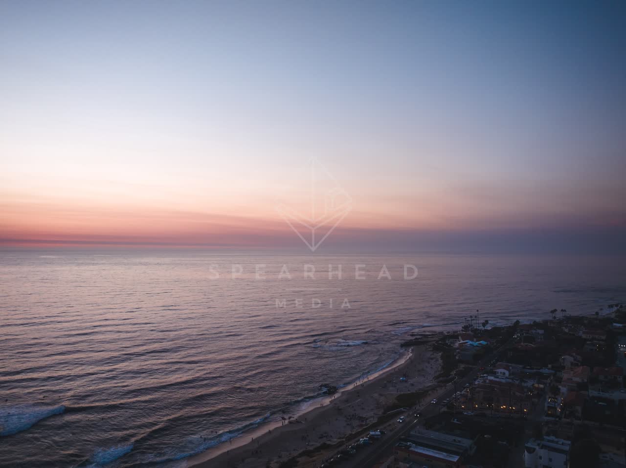 Aerial view of the beach, the ocean and homes at Windansea.