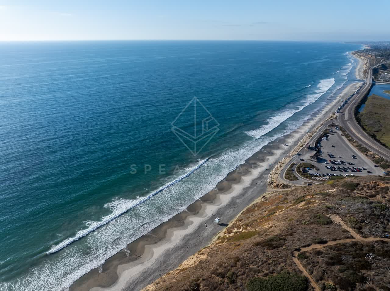 Aerial view of the beach, the surf and the ocean at Torrey Pines.