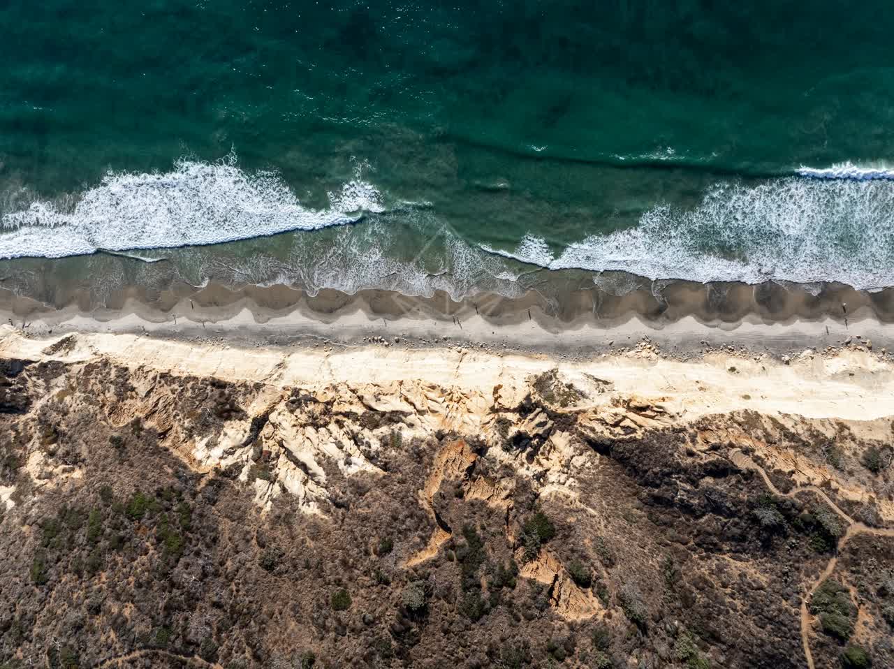 Aerial view of the beach, the surf and the ocean at Torrey Pines.