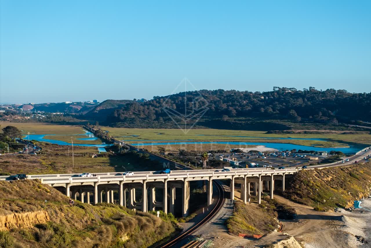 Aerial view of the country inland, the bridge and traffic in Del Mar.