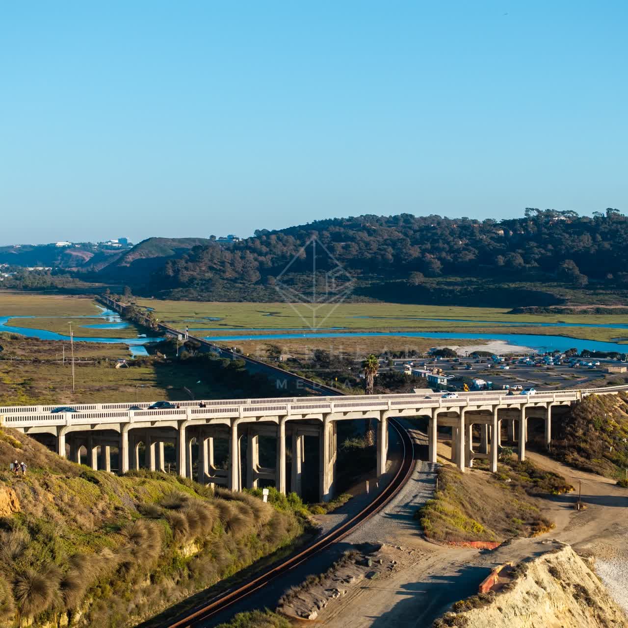 Aerial view of the country inland, the bridge and traffic in Del Mar.