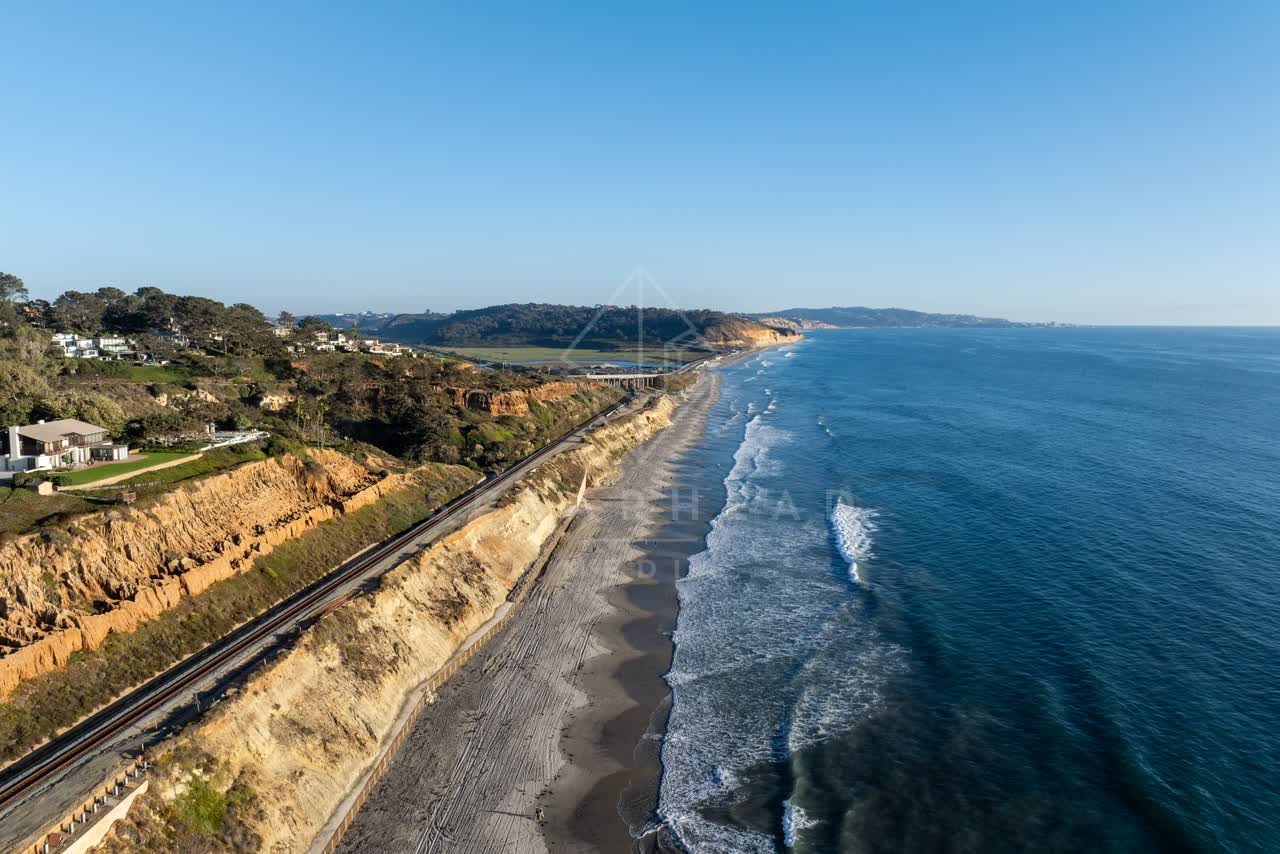 Aerial view of the cliffs, the surf and the ocean in Del Mar.