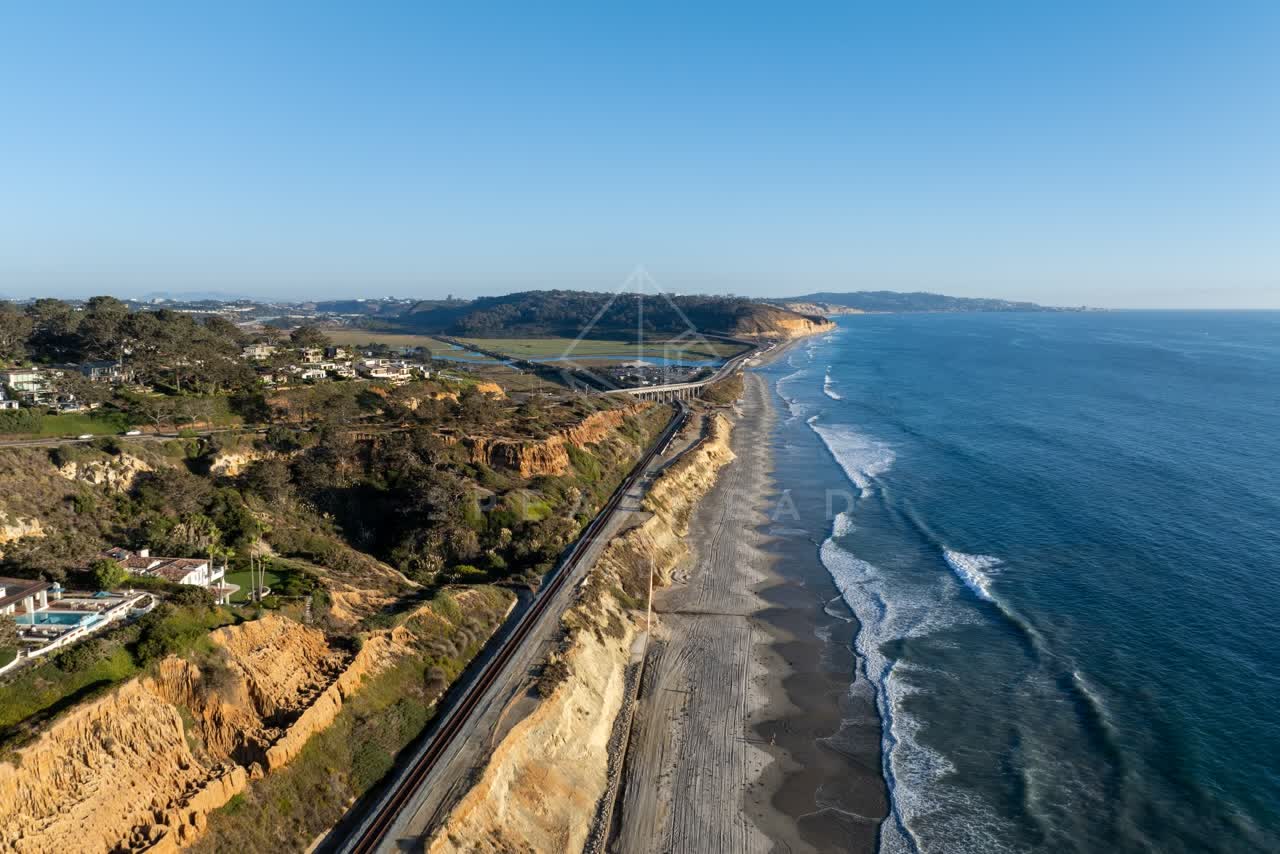 Aerial view of the cliffs, the ocean and homes in Del Mar.
