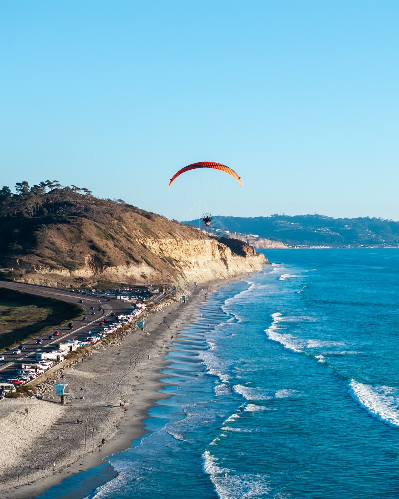 Aerial view of the cliffs, the surf and the ocean at Torrey Pines.