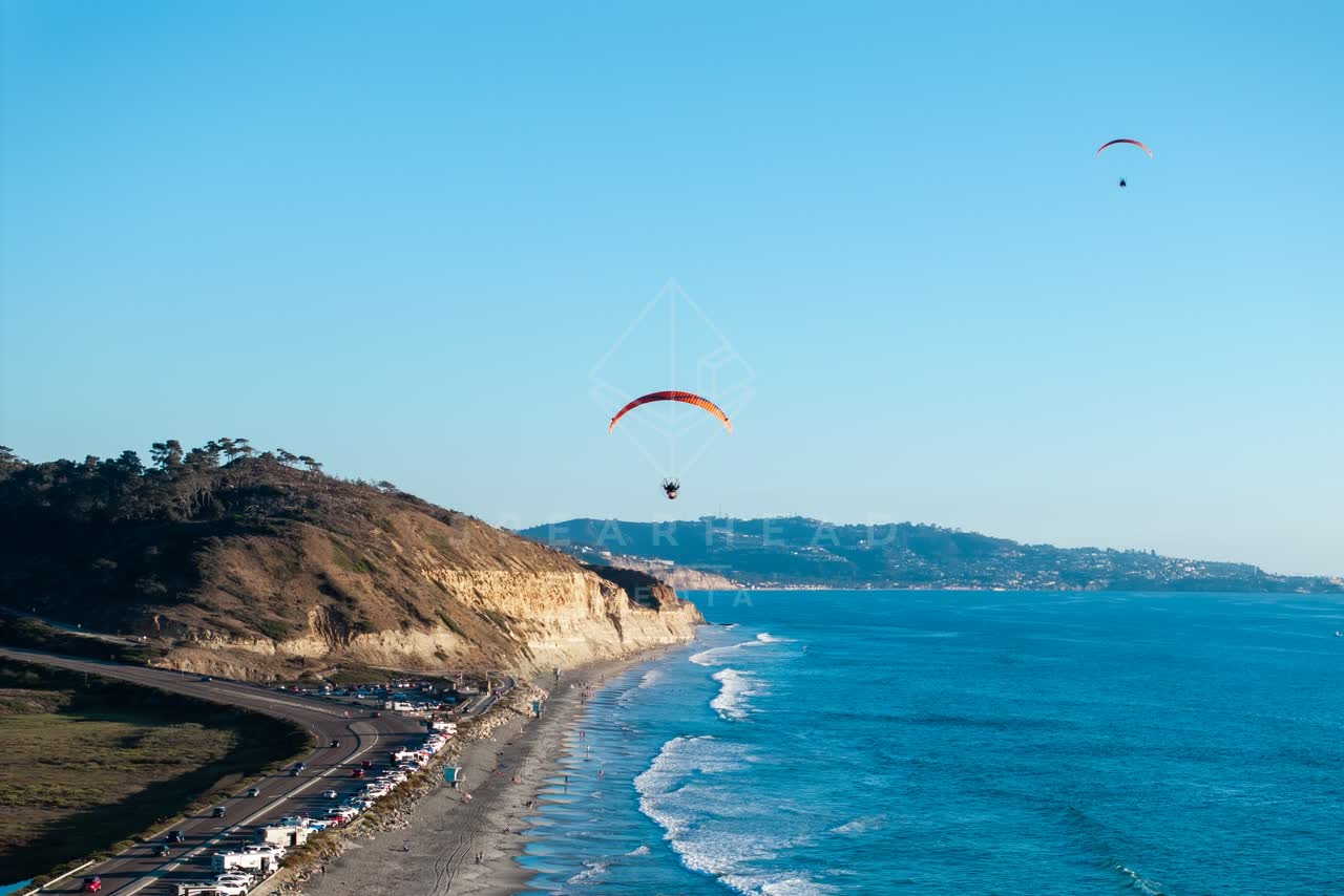 Aerial view of the cliffs, the surf and the ocean at Torrey Pines.
