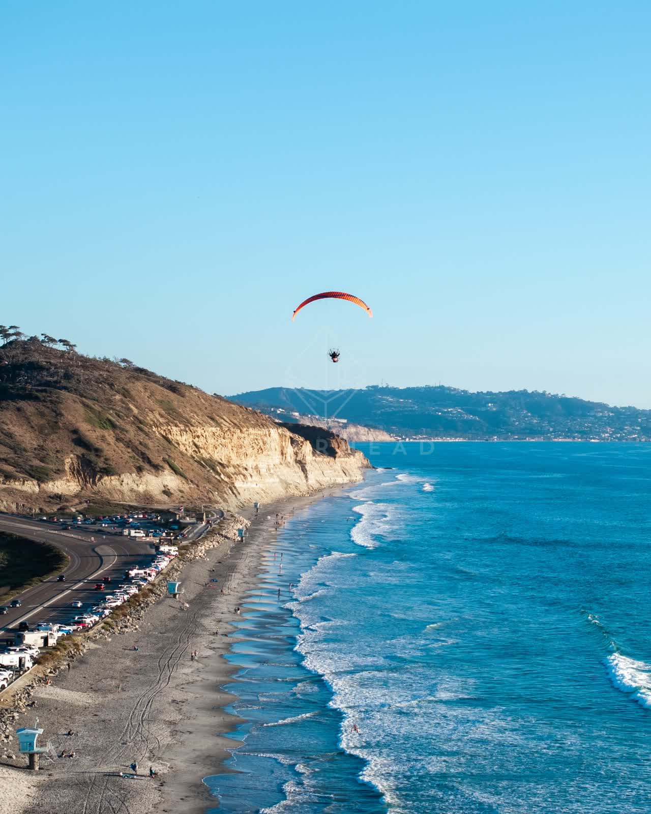 Aerial view of the cliffs, the surf and the ocean at Torrey Pines.