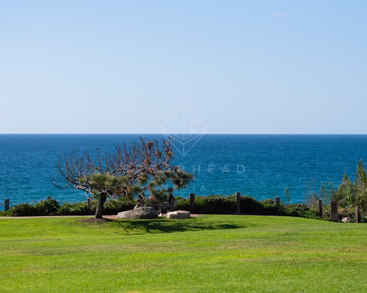 Elevated view of the cliffs, the ocean and open country at Powerhouse Park.