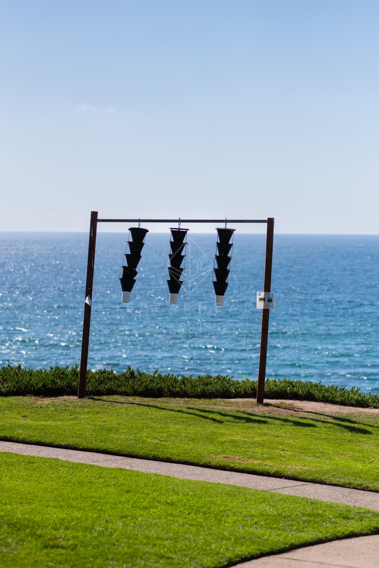 Elevated view of a park, the ocean and open country at Powerhouse Park.
