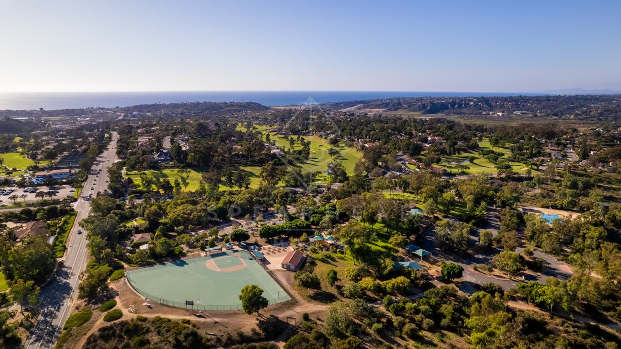 Aerial view of a residential street, the ocean and homes in Solana Beach.