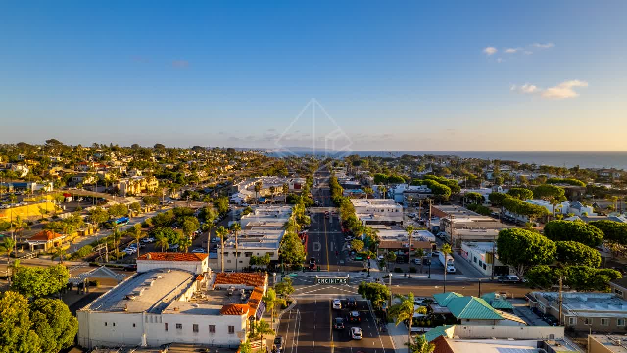 Aerial view of the downtown streets, palm trees and the ocean at Downtown Encinitas.