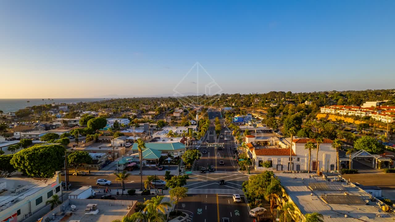Aerial view of the downtown streets, palm trees and the ocean at Downtown Encinitas.