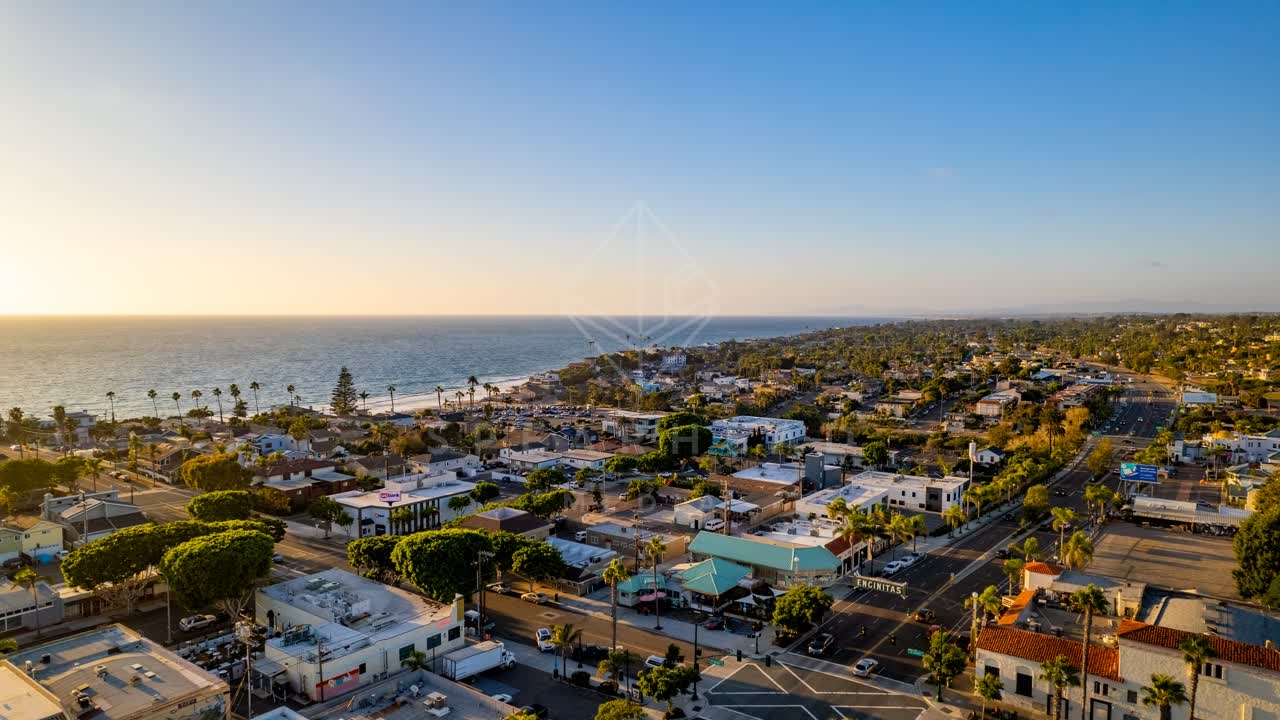 Aerial view of the downtown streets, palm trees and the ocean at Downtown Encinitas.