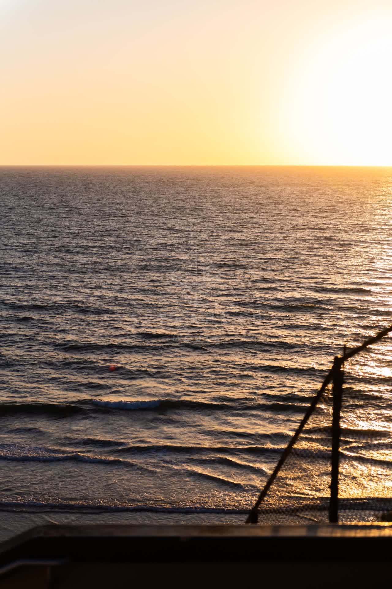 Elevated view of the beach, the surf and the pier in Encinitas.