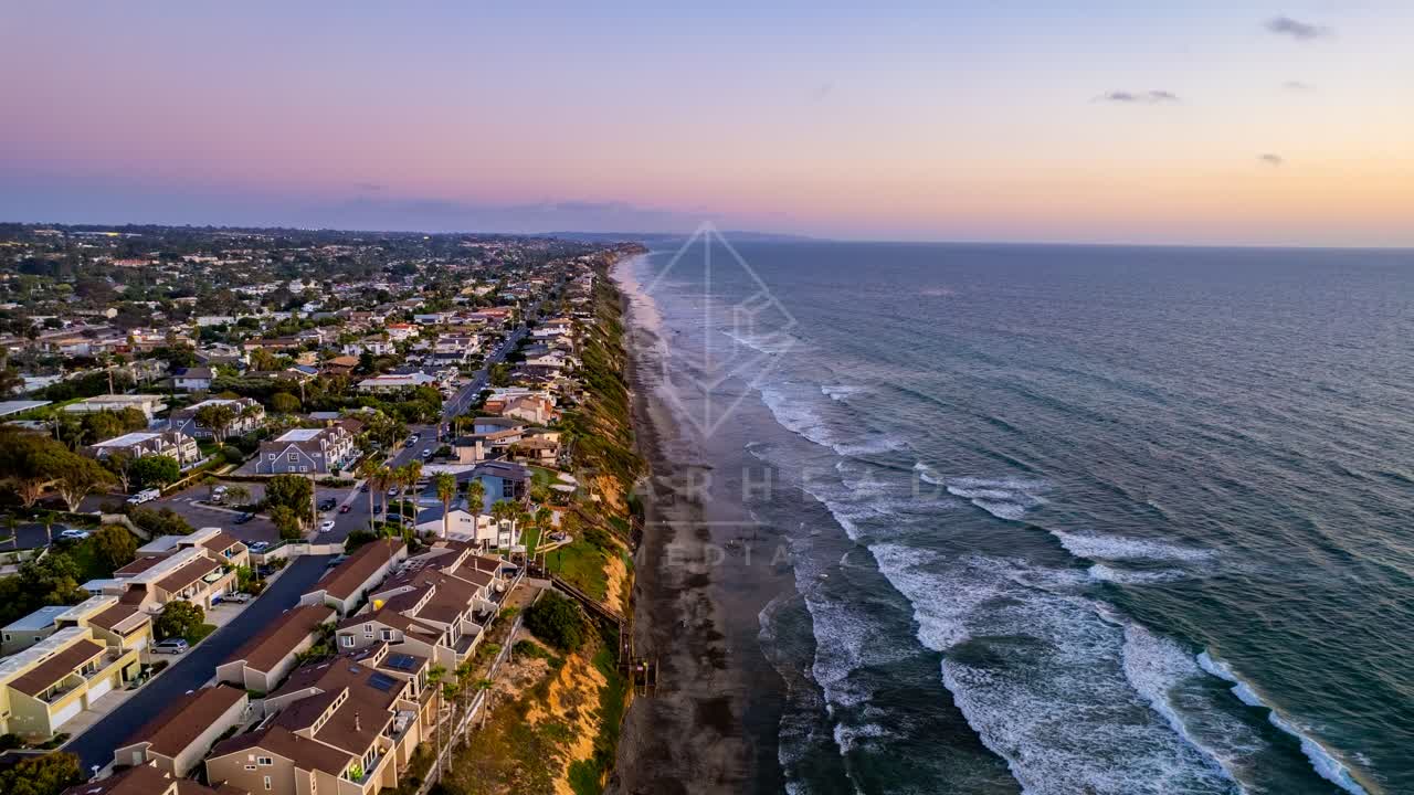 Aerial view of a residential street, the ocean and homes in Encinitas.