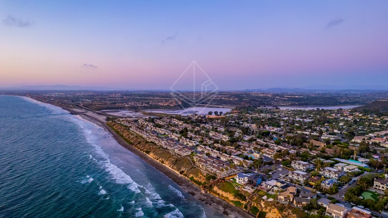 Aerial view of a residential street, the ocean and homes in Encinitas.