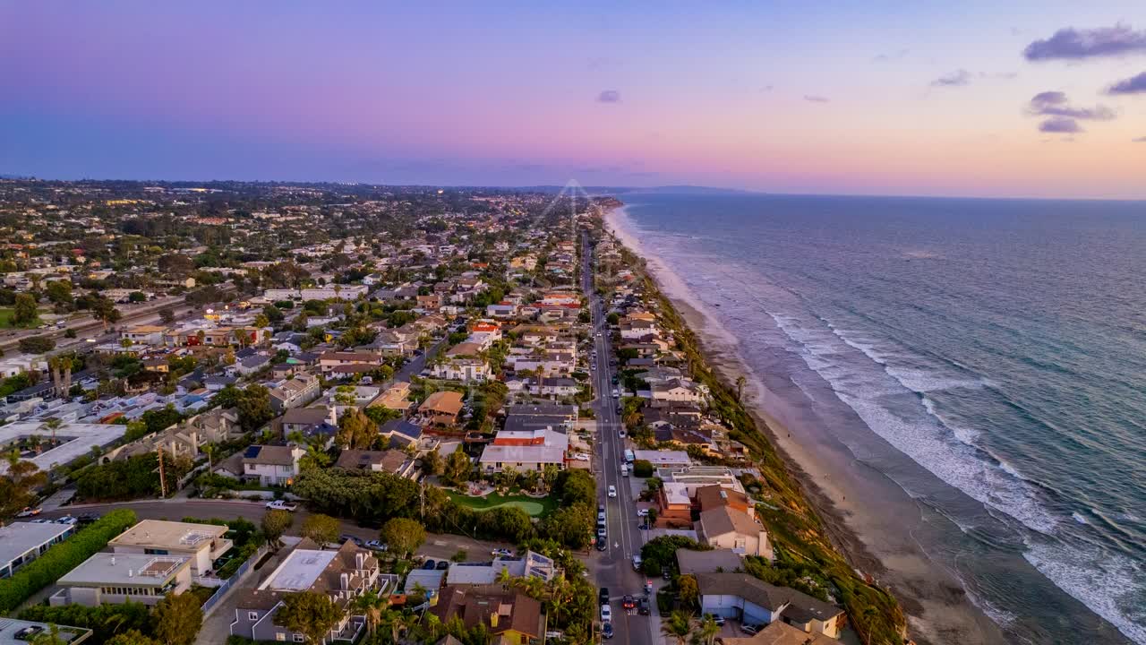 Aerial view of a residential street, the ocean and homes in Encinitas.