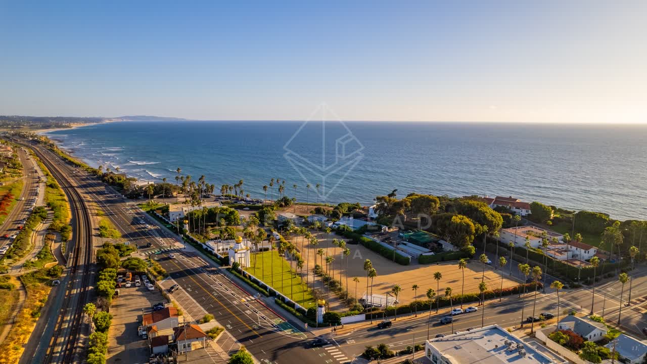 Aerial view of a residential street, the surf and palm trees at Swamis.