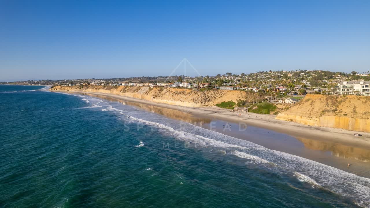 Aerial view of the cliffs, the surf and the ocean at Fletcher Cove.