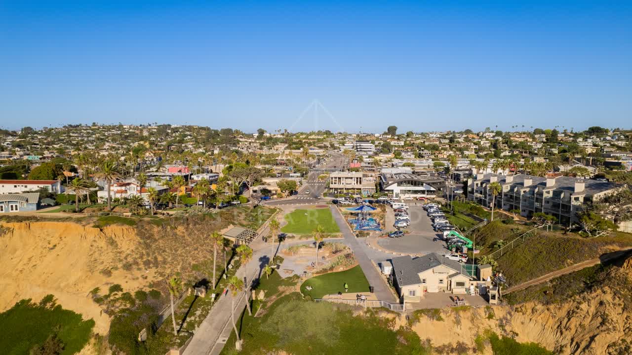 Aerial view of the cliffs, palm trees and homes at Fletcher Cove.