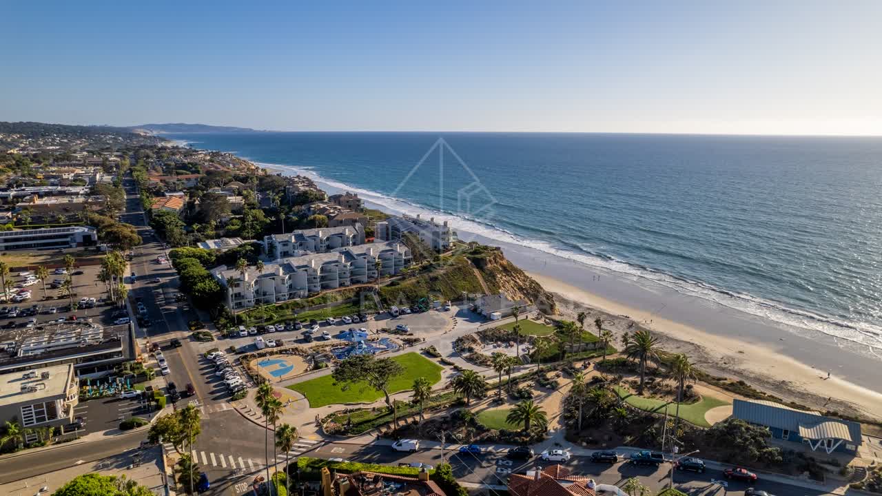 Aerial view of the beach, palm trees and the ocean at Fletcher Cove.