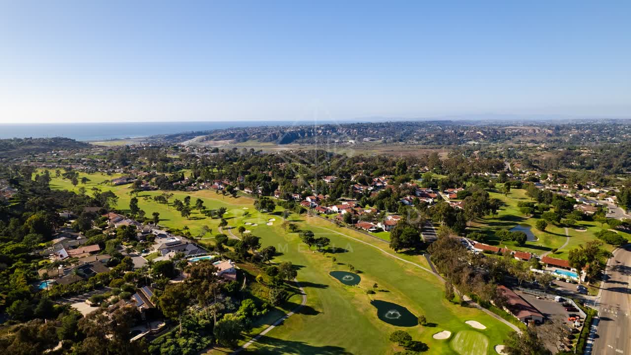 Aerial view of a residential street, the ocean and homes in Solana Beach.