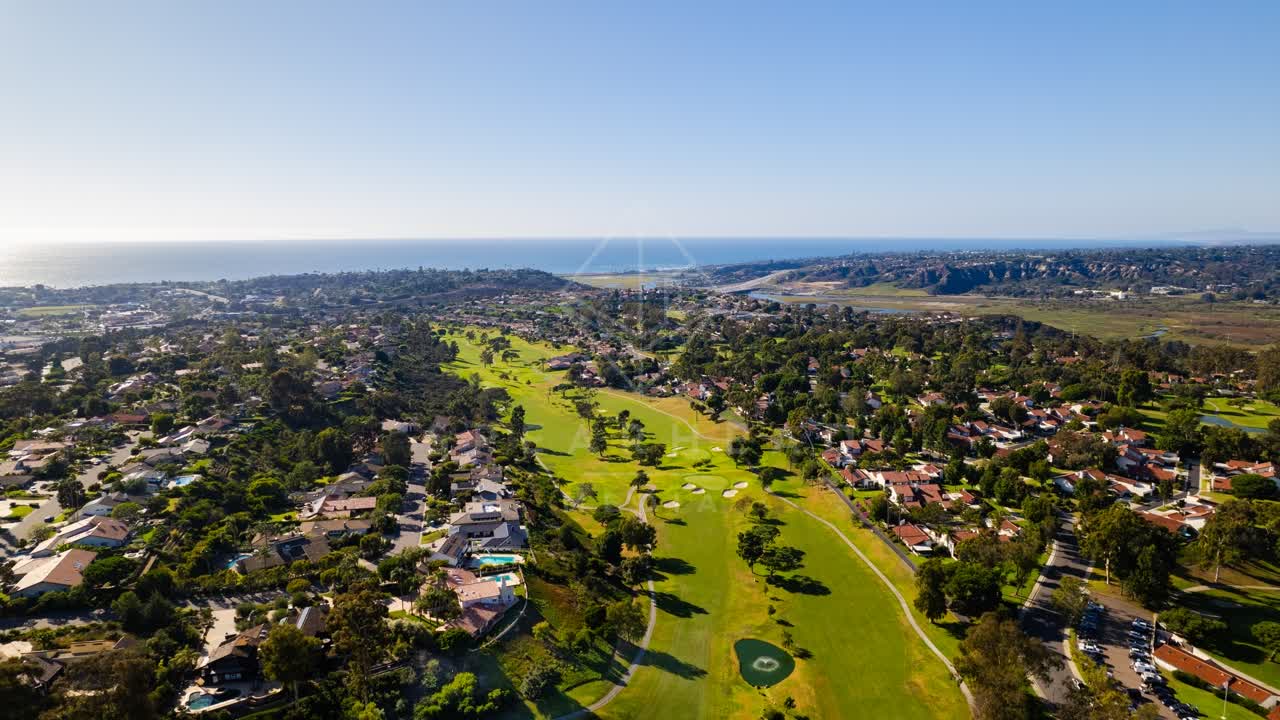 Aerial view of a residential street, the ocean and homes in Solana Beach.