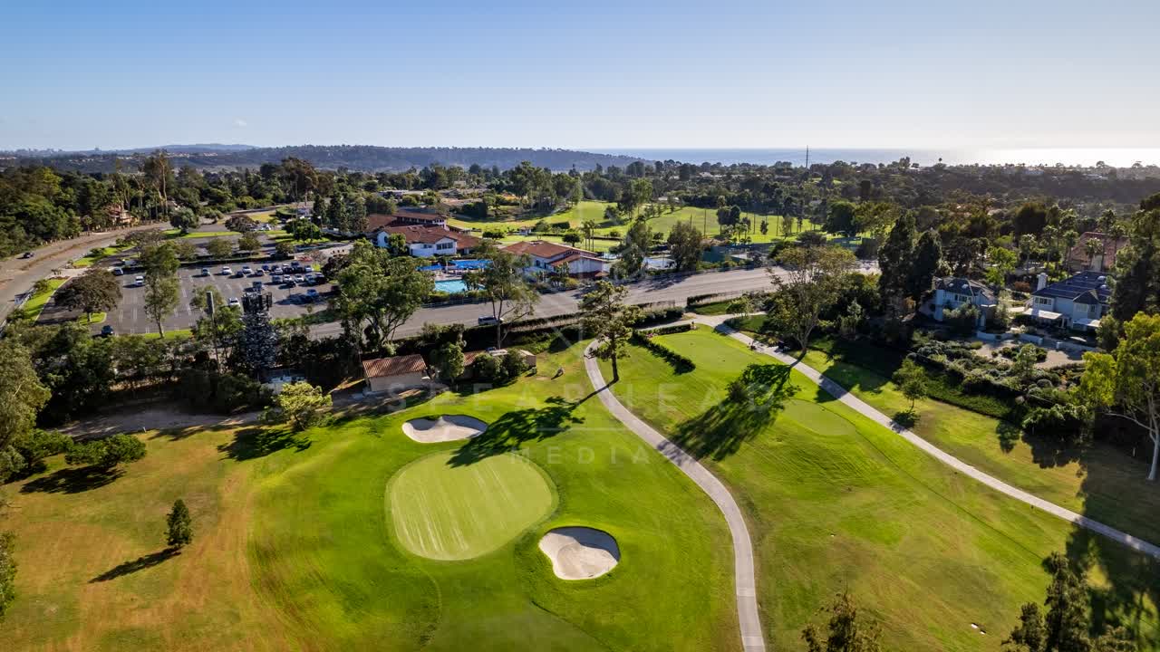 Aerial view of the country inland, the ocean and homes in Solana Beach.