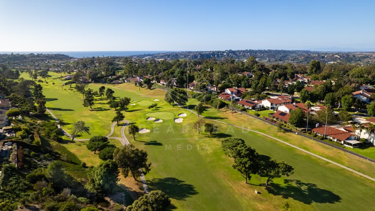 Aerial view of the country inland, the ocean and homes in Solana Beach.