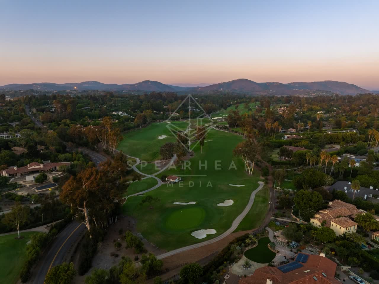 Aerial view of the country inland, palm trees and homes at Covenant.
