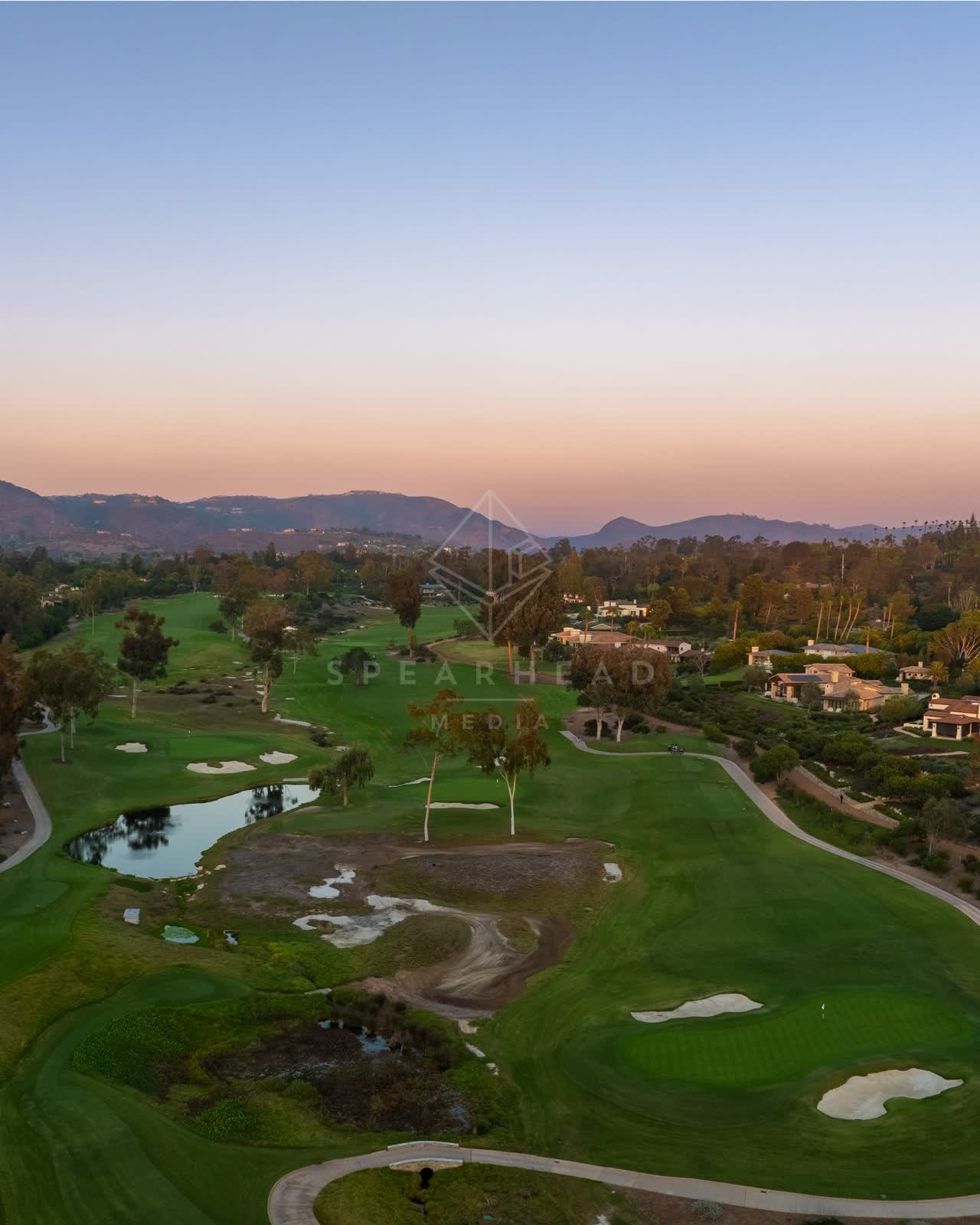 Aerial view of the country inland, palm trees and homes at Covenant.