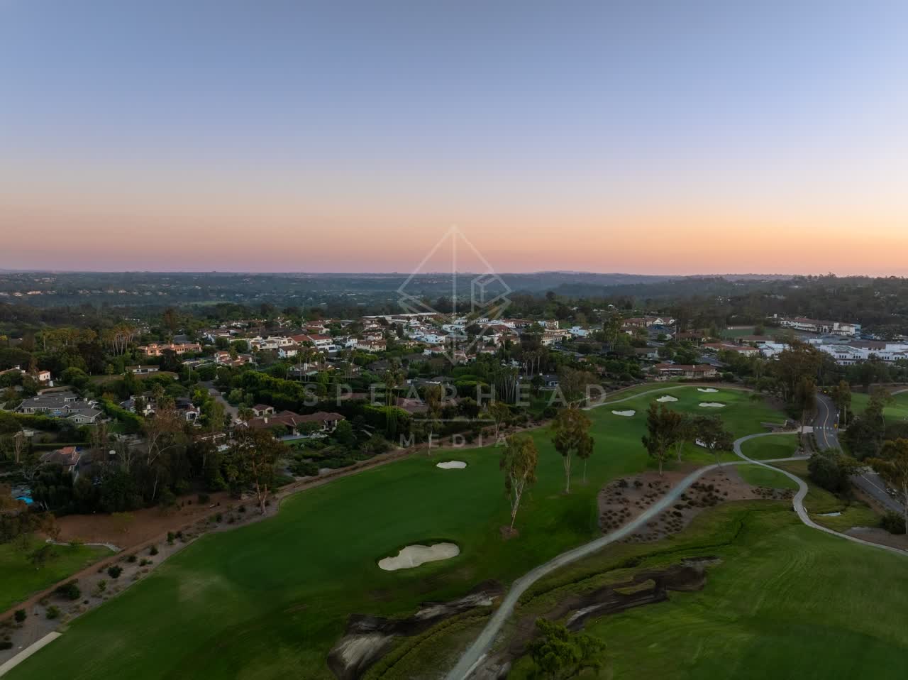 Aerial view of the country inland, palm trees and homes at Covenant.