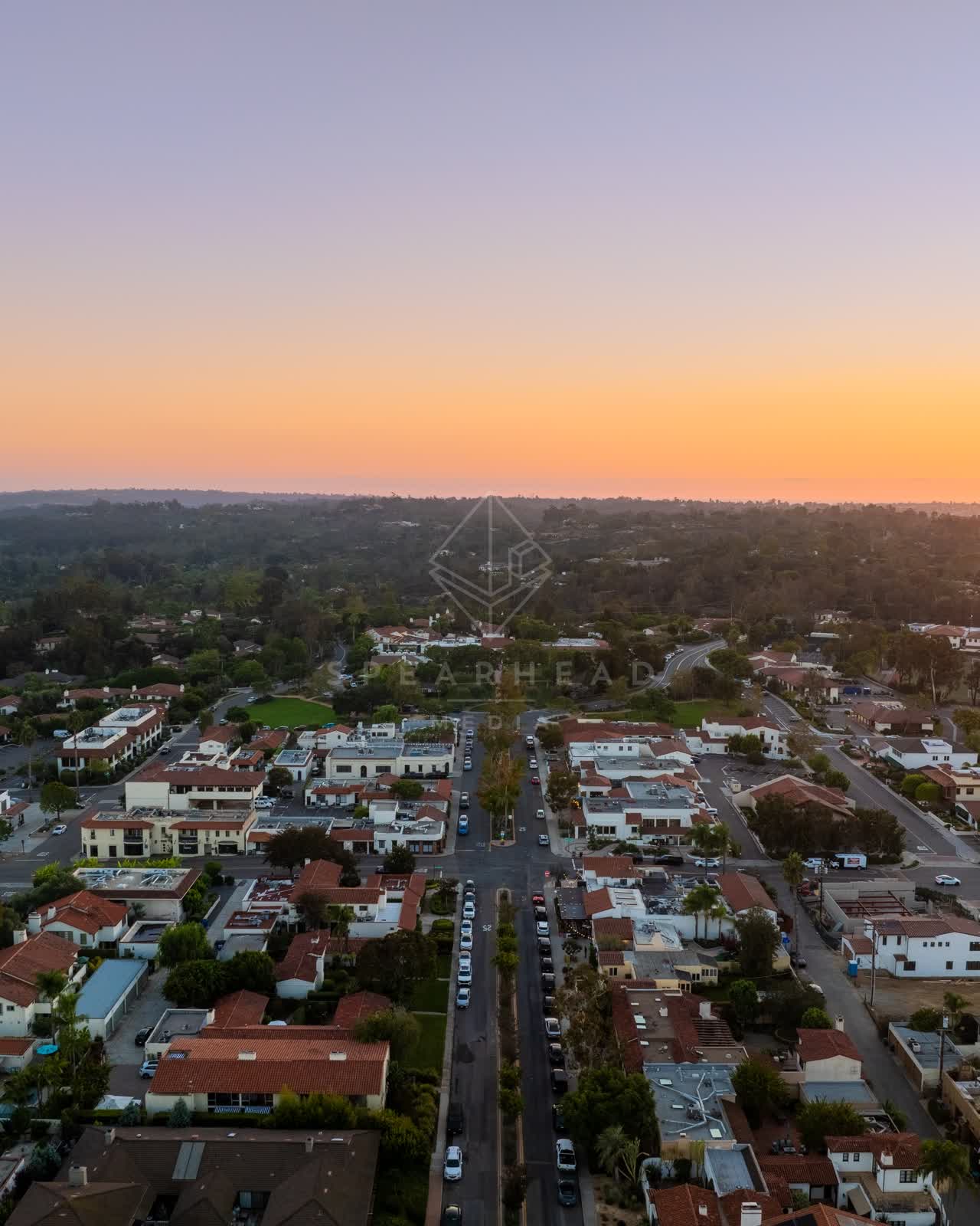 Aerial view of a residential street, homes and traffic at Covenant.