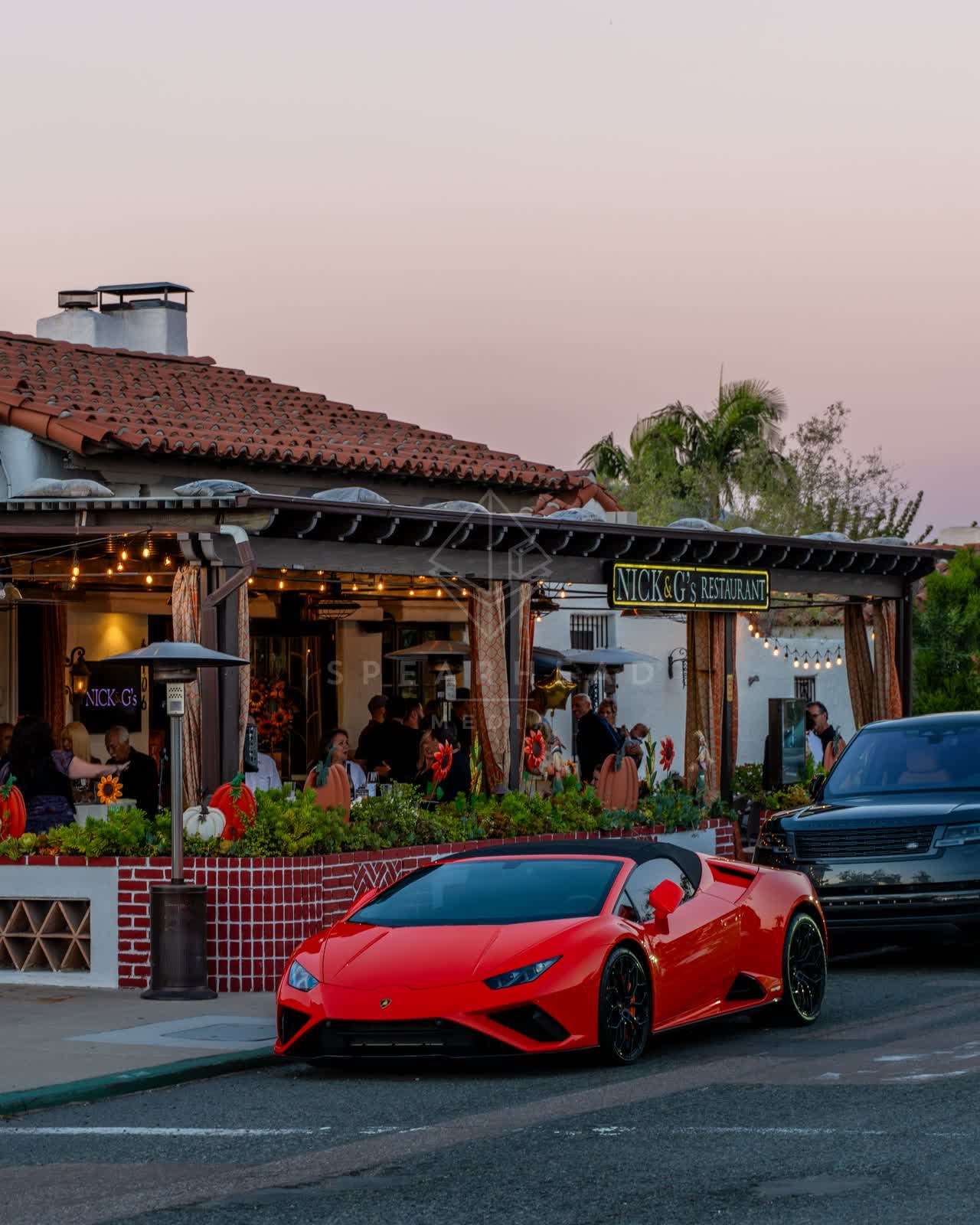 The downtown streets, palm trees and homes at Covenant, with people eating outside.