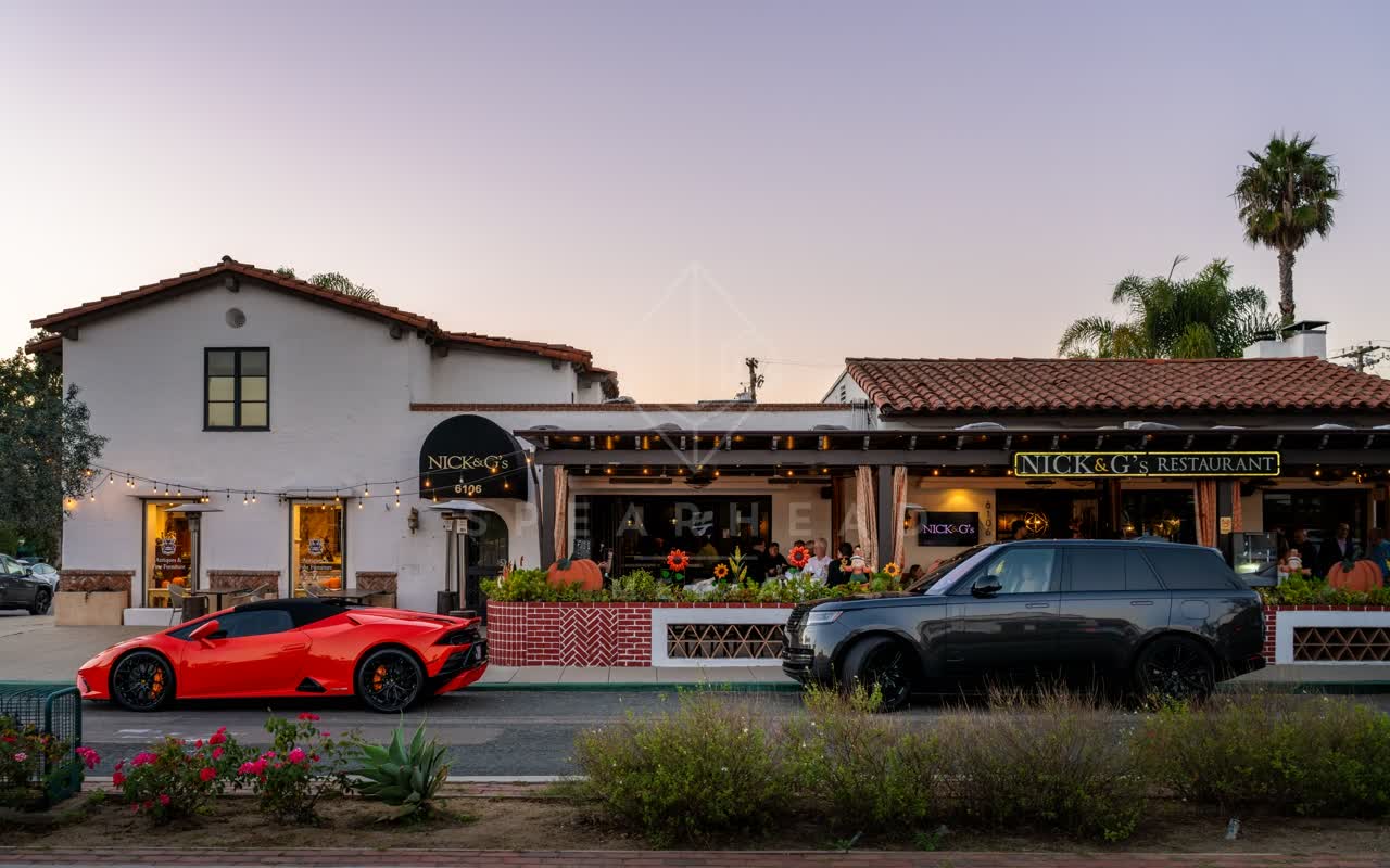 The downtown streets, palm trees and homes at Covenant, with people eating outside.