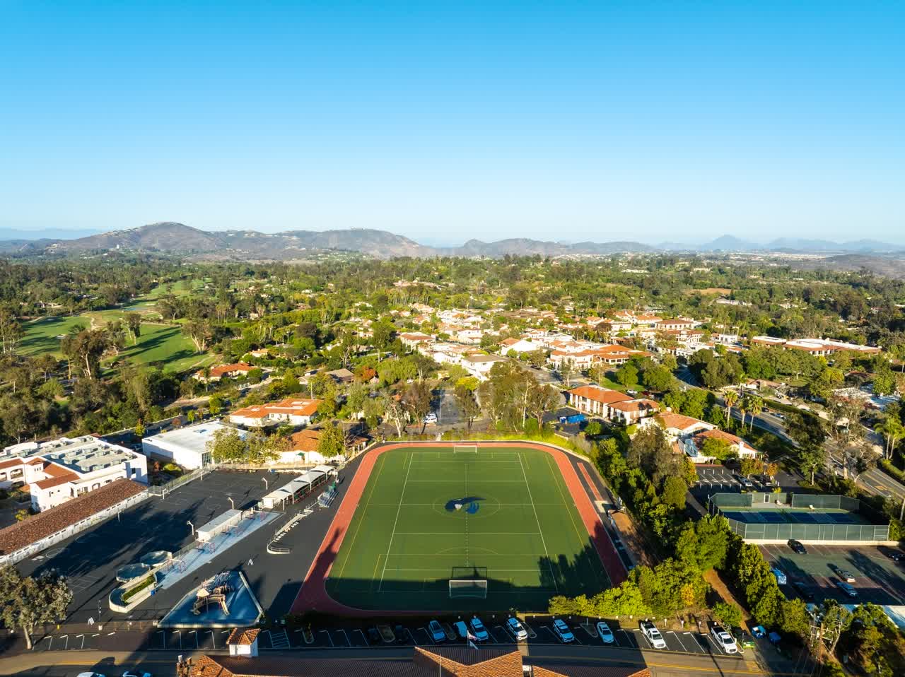 Aerial view of a residential street, homes and the buildings at Covenant.