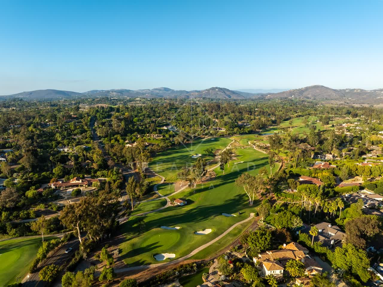 Aerial view of the country inland, palm trees and homes at Covenant.
