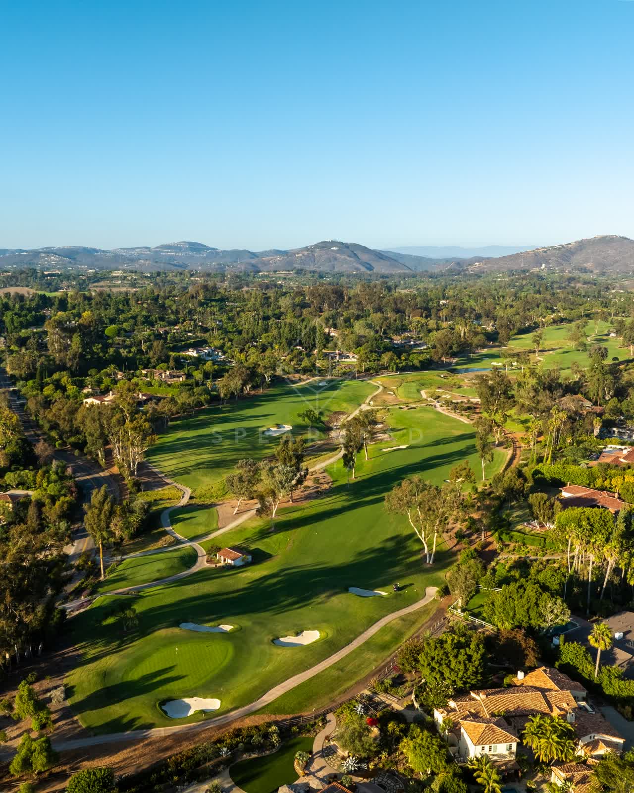 Aerial view of the country inland, palm trees and homes at Covenant.