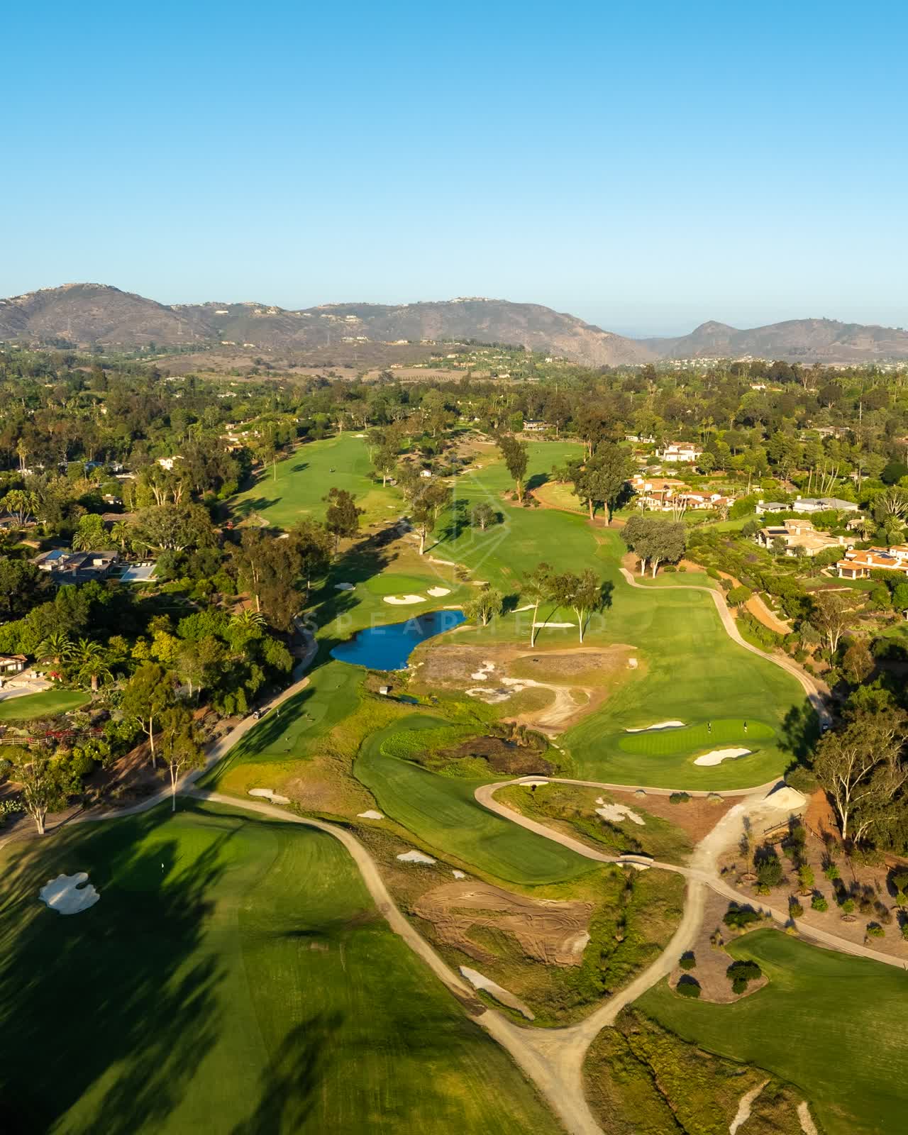 Aerial view of the country inland, palm trees and homes at Covenant.