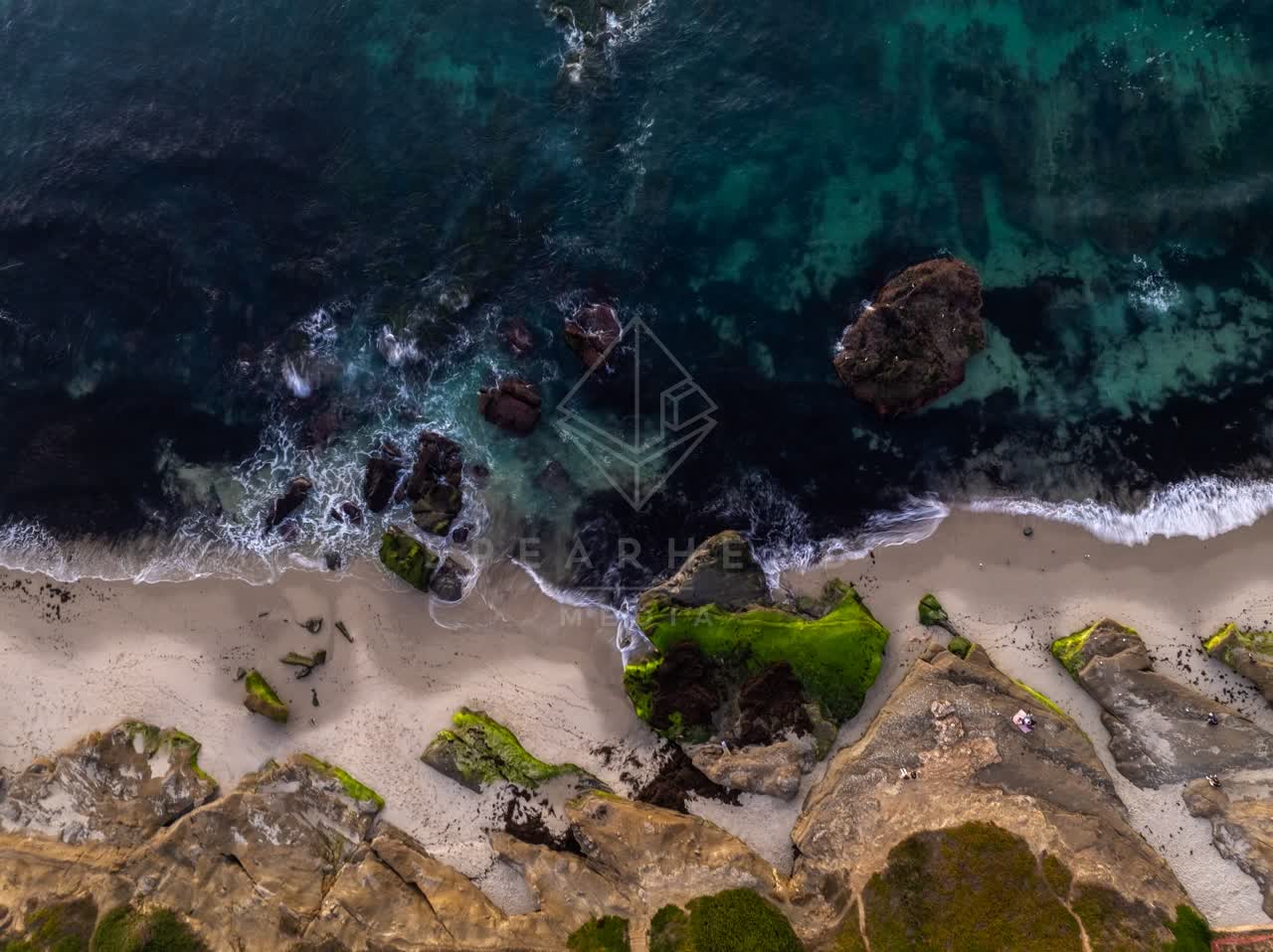 Aerial view of the beach, the surf and the ocean at Windansea.