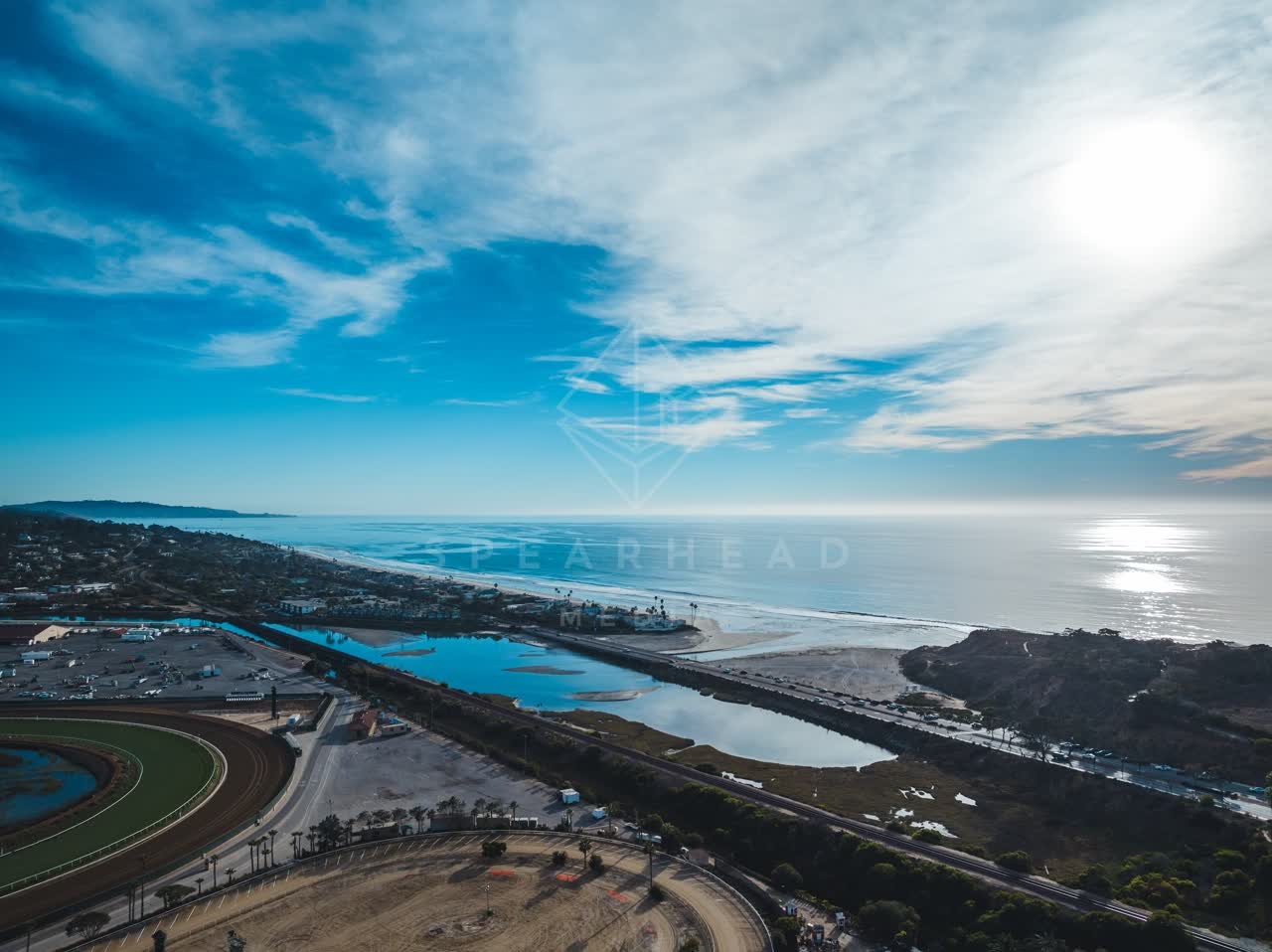 Aerial view of the beach, the ocean and traffic at Del Mar Dog Beach.