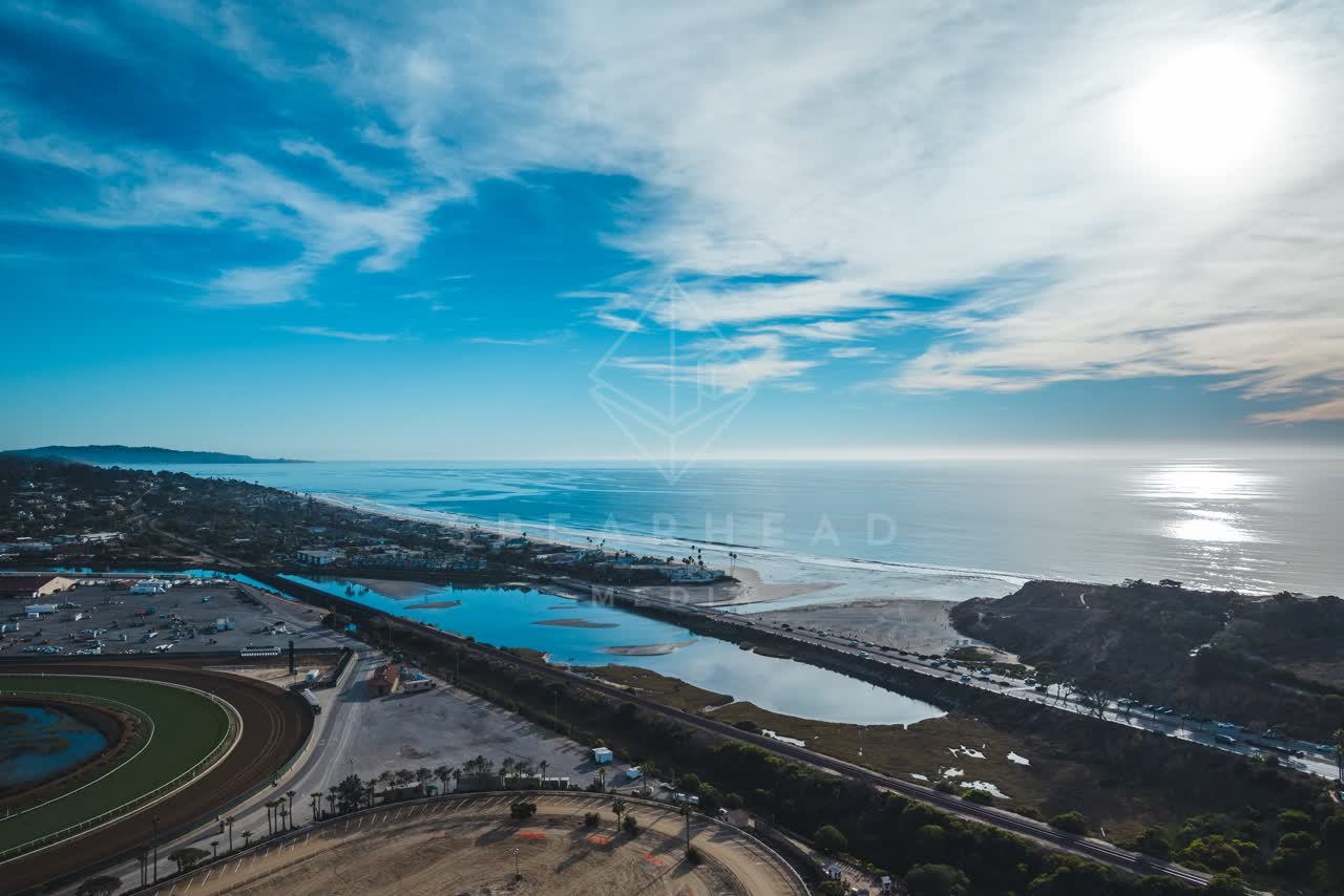 Aerial view of the beach, the ocean and traffic at Del Mar Dog Beach.
