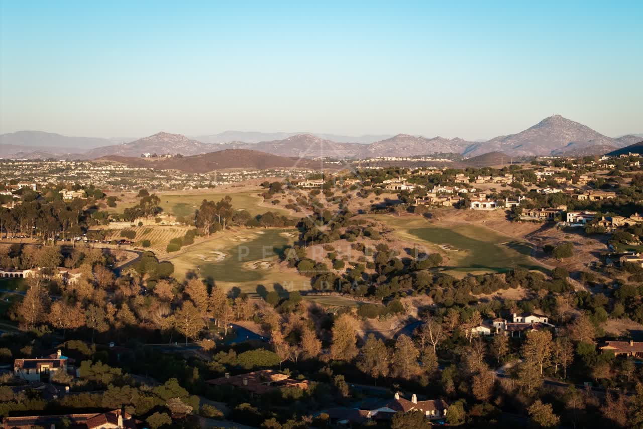 Aerial view of the country inland, homes and open country in Santaluz.