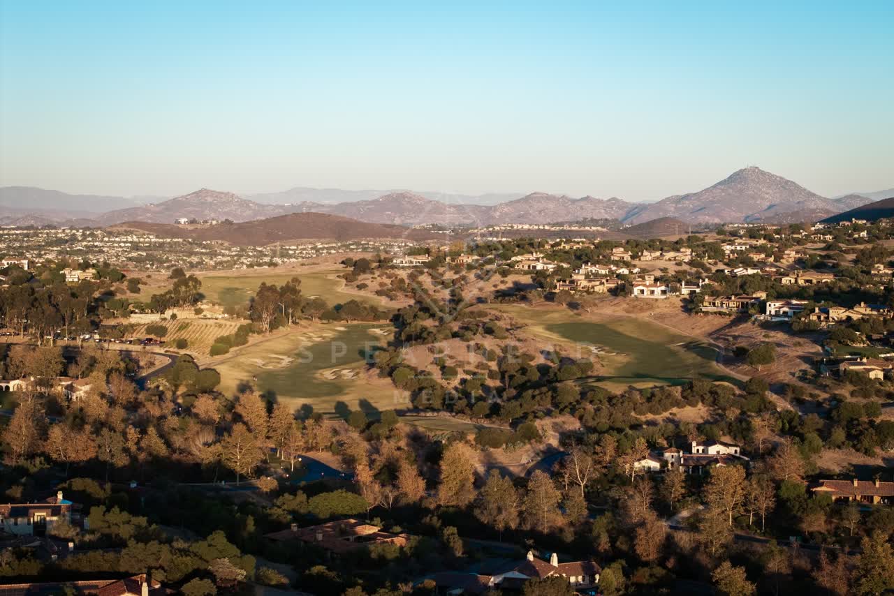 Aerial view of the country inland, homes and open country in Santaluz.