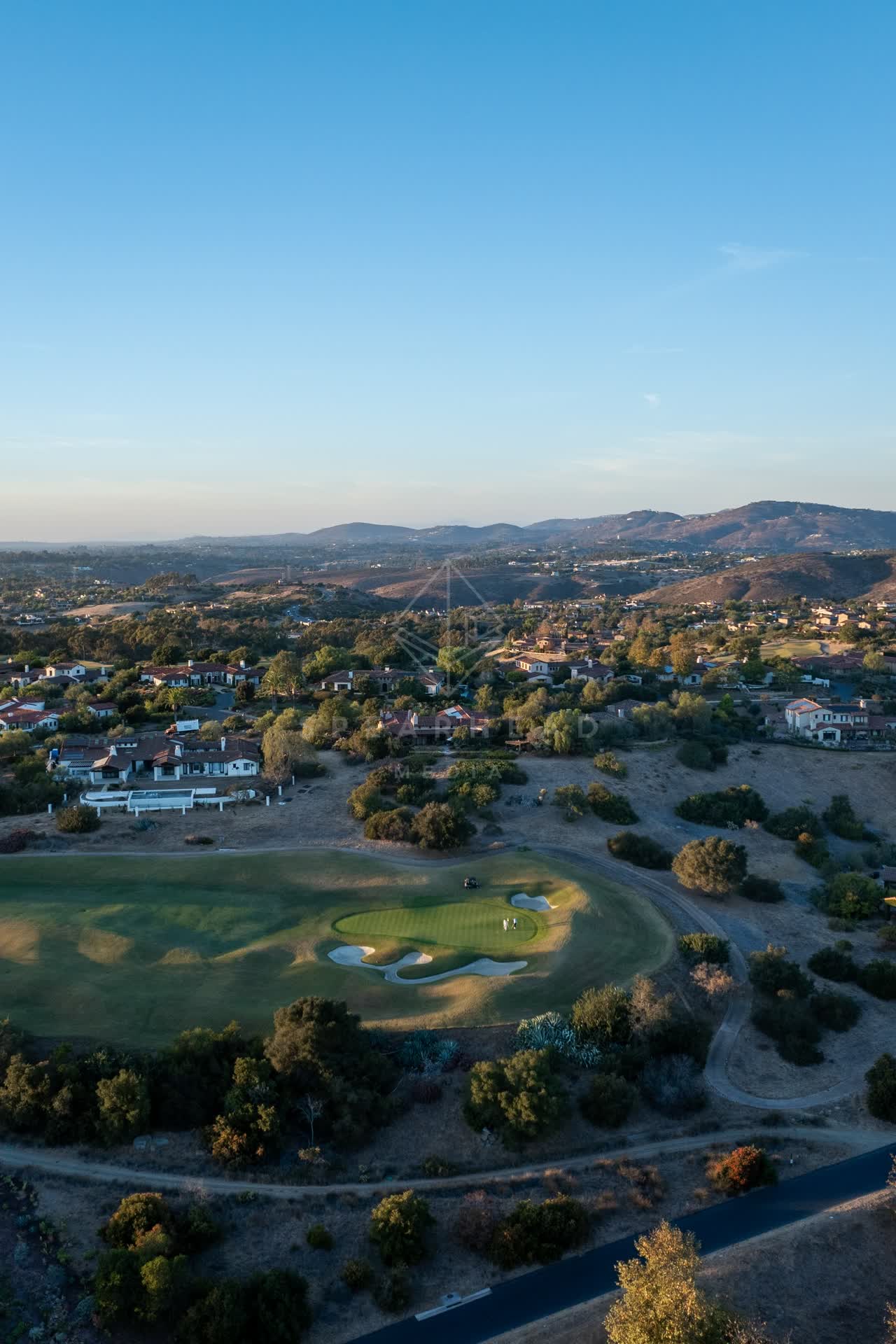 Aerial view of the country inland, homes and the buildings in Santaluz.